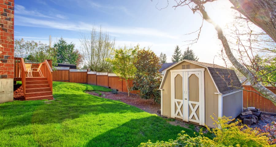 Fenced backyard with storage shed in St. Paul